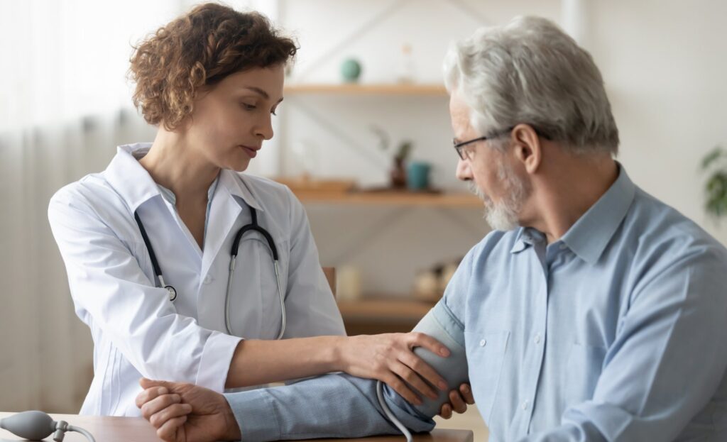 Cardiologist measuring a patient's blood pressure