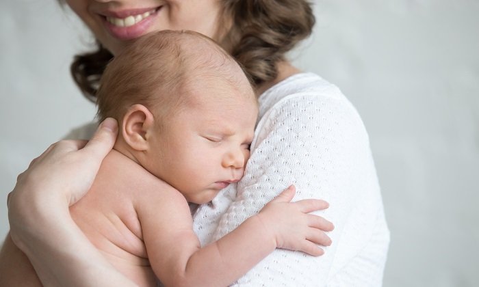 Mother holding her newborn baby