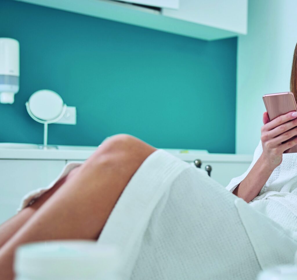 Woman relaxing in a robe during treatment