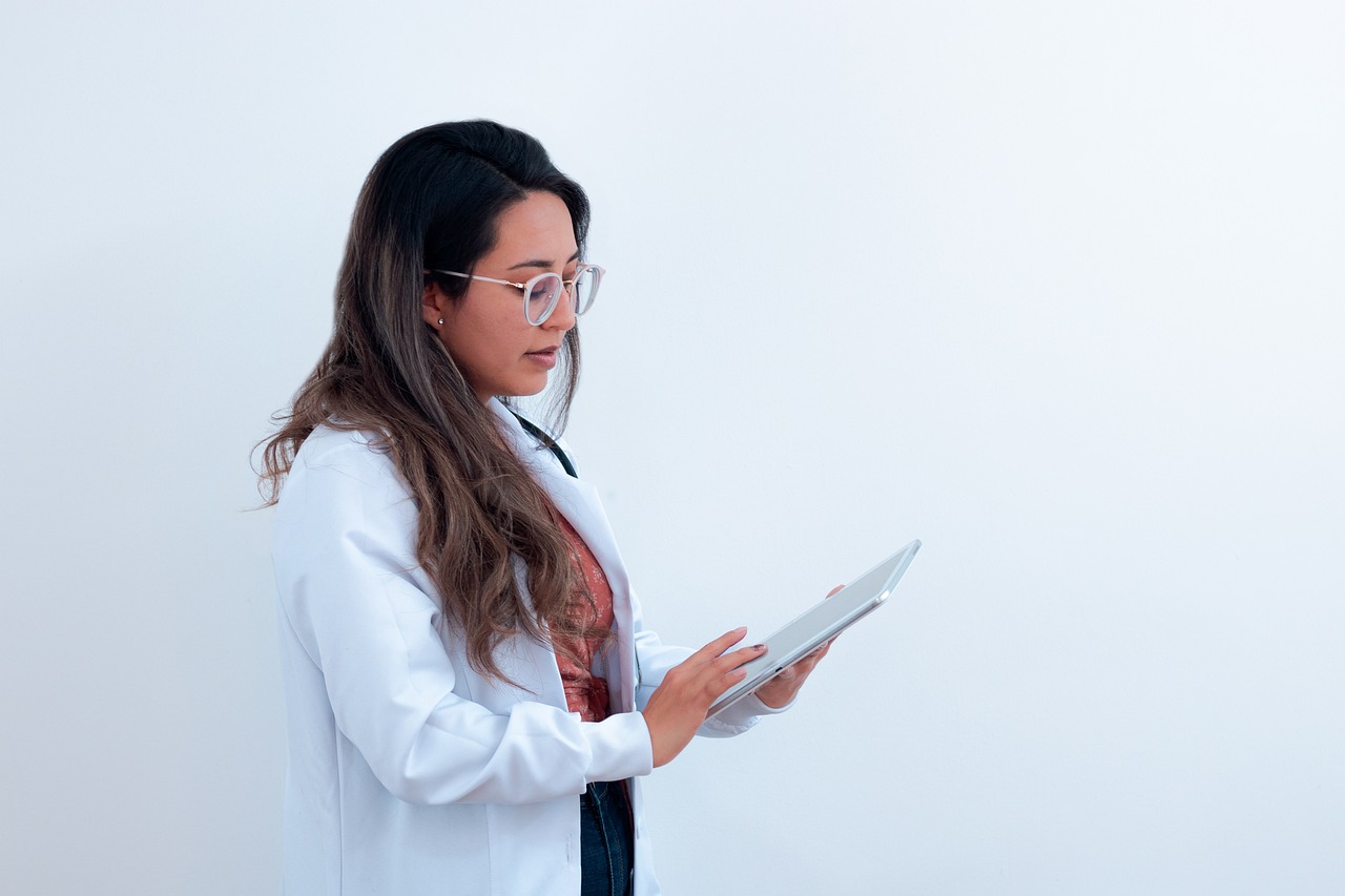 Nurse reviewing patient information on a tablet